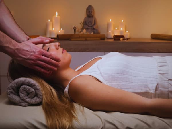 Woman having Reiki therapy